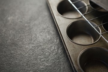 Cropped image of cooling rack on muffin tin
