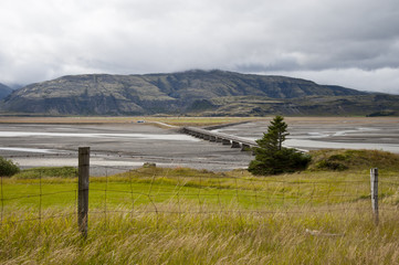 Typical Icelandic landscape, a wild nature of rocks and shrubs, rivers and lakes.