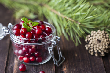 fresh cranberries on a wooden background