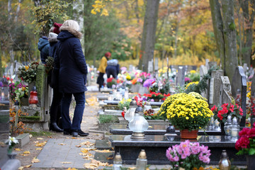 People at the cemetery on the feast of all saints day at 1st November