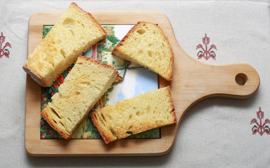 Burnt toast of white bread on a cutting Board