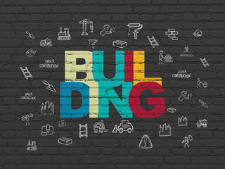 Constructing concept: Painted multicolor text Building on Black Brick wall background with  Hand Drawn Construction Icons