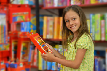 girl holding plastic toy