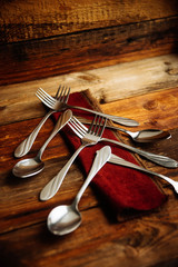 Abstract christmas tree made from cutlery on a dark slate,grey stone or concrete background.Top view with copy space.