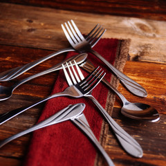 Abstract christmas tree made from cutlery on a dark slate,grey stone or concrete background.Top view with copy space.