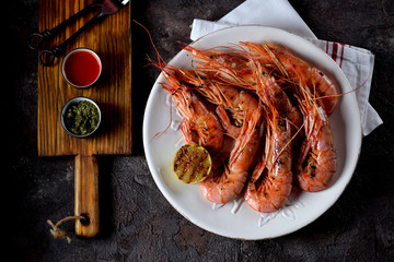 Grilled shrimp with garlic, soy sauce, olive oil, ginger and chili pepper. Top view.