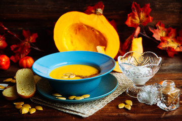Pumpkin soup served in a hollowed pumpkins