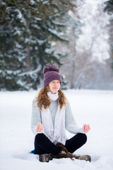 woman meditating in winter