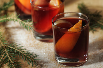 Hot wine drink. Warm Christmas wine. Mulled wine with oranges an