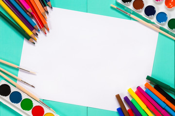 bright colors, pencils and school supplies on the table