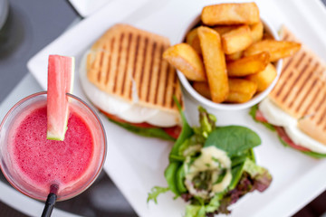 Cocktail glasses with hotel view.