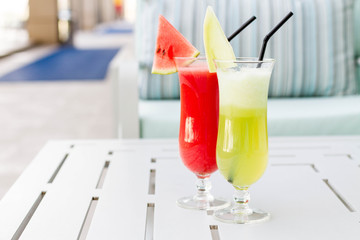 Cocktail glasses with hotel view.