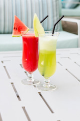 Cocktail glasses with hotel view.