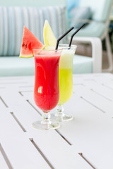 Cocktail glasses with hotel view.