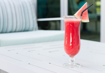 Cocktail glasses with hotel view.