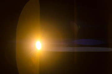 The bright projector light on the dark background. anamorphic lens shot