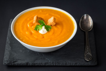 Creamy pumpkin soup with vegetables and spices.