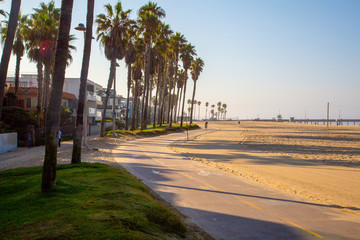 Morning sunrise lights at the Venice beach in Los Angeles. Bicycle lane by the beach.