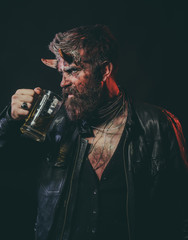 Halloween man demon drink beer on black background