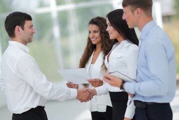 handshake business women and business partner