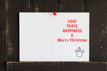 Love, Peace, Happiness and Merry Christmas Card on the reclaim wood.