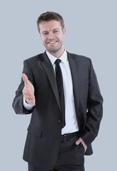 Portrait of happy business man inviting to cooperation isolated 
