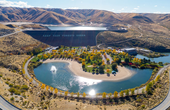 Sparkling water below Luck Peak Dam in Idaho with autumn trees