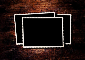 Photo frame on old wooden table