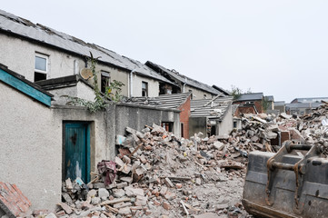 Derelict terraced houses ready to be demolished to make way for new homes