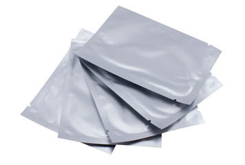Fototapeta premium Cosmetic goods in silver, sealed packaging on a white isolated background.