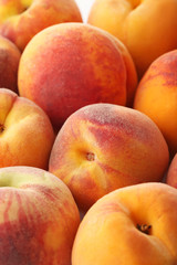 Ripe and sweet peaches fruit background