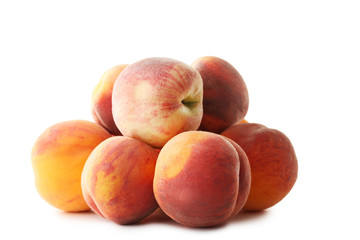 Ripe peaches fruit isolated on a white background