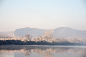 Morning on the river early morning reeds mist fog and water surface on the river