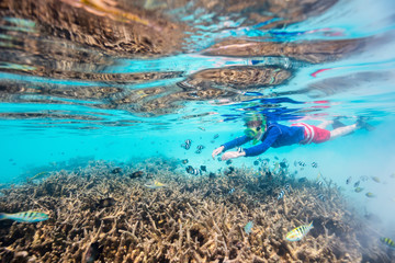 Fototapeta na wymiar Boy swimming underwater