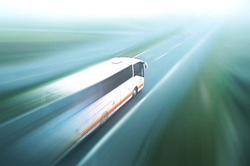 Fototapeta na wymiar Coach on asphalt road motion blur