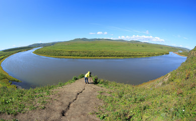 Photographer taking photo in beautiful landscape