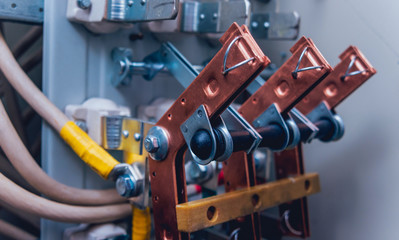 Wires and switches in electric box. Electrical panel with fuses and contactors