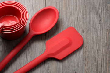 Red Spatula, Spoon and Measuring Cups on Counter