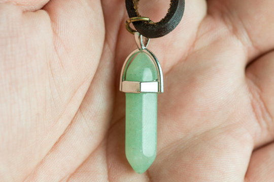 Lucky green aventurine semiprecious stones necklace in the hand