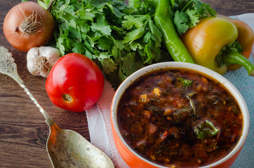 Bowl of traditional soup Borscht on table