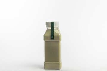 Protein rich drink in plastic bottle. White background. Organic nutrition. Small size bottle.