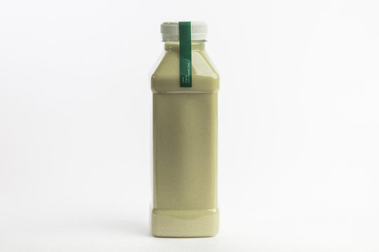 Picture of protein rich drink in plastic bottle. White background. Organic nutrition. Big size bottle.