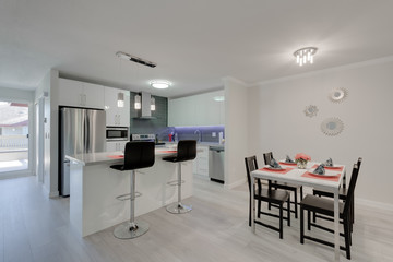 Interior design of a modern kitchen with living room.