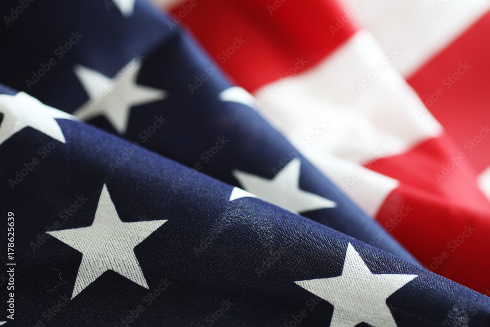 Wall mural american flag on a wooden texture table