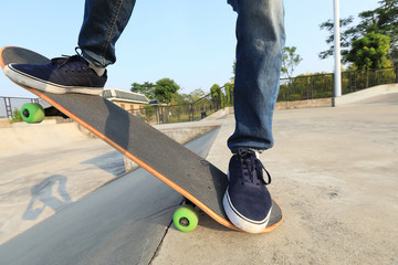 skateboarder legs skateboarding on skatepark