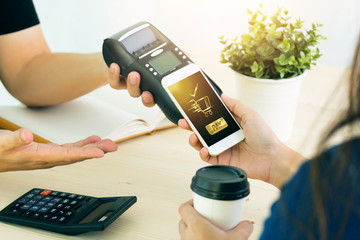 Mobile Payment with NFC technology  on Smartphone shopping online with filter effect.
