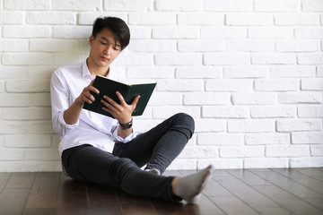 Asian young man student with books