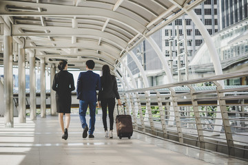 Business man and woman are going on business trip.