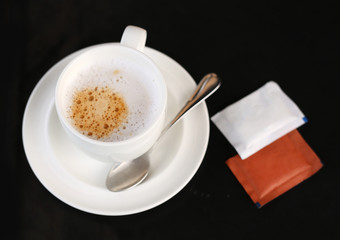 Cup of espresso coffee on the table.