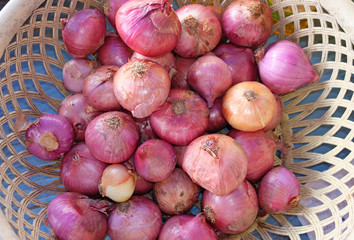 Red onions in basket.